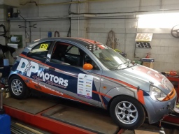 Image of a racing car on ramps